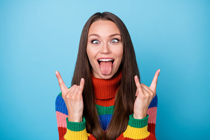 portrait-c___dish-playful-crazy-youth-girl-student-fooling-make-horned-symbol-show-tongue-out-wear-style-stylish-trendy-sweater-isolated-blue-color-background
